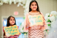 Lovely Indain grils holding Indian wedding signs at ceremony. Lovely Indain grils holding Indian wedding signs at ceremony.