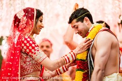 Indian bride putting garland to groom ritual. Indian bride putting garland to groom ritual.