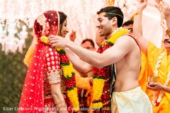 Indian bride getting her garland from groom. Indian bride getting her garland from groom.