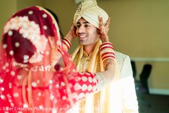 Maharani putting grooms turban. Maharani putting grooms turban.