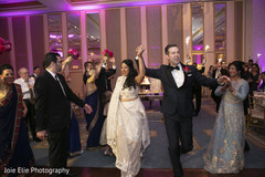 Indian bride and groom's entrance to wedding reception Indian bride and groom's entrance to wedding reception