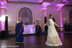 Indian bride dancing with bridesmaids on her wedding reception party Indian bride dancing with bridesmaids on her wedding reception party