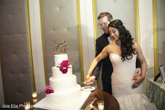 Lovely capture Indian bride and groom cutting cake together Lovely capture Indian bride and groom cutting cake together