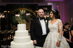 Indian wedding reception cutting the cake scene. Indian wedding reception cutting the cake scene.