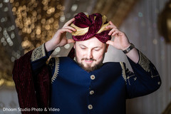 Charming Indian groom getting his turban on. Charming Indian groom getting his turban on.