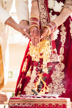 Indian bride and groom during the holy fire rituals. Indian bride and groom during the holy fire rituals.