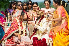 Indian groom putting necklace on his bride. Indian groom putting necklace on his bride.