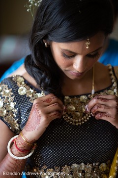 Beautiful Maharani putting necklace on. Beautiful Maharani putting necklace on.