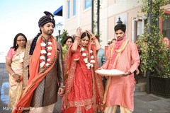 Indian bride and groom walking outside the venue Indian bride and groom walking outside the venue