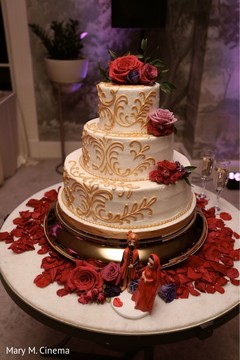 White and golden Indian wedding cake White and golden Indian wedding cake