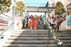 indian bride and groom walking out the street indian bride and groom walking out the street