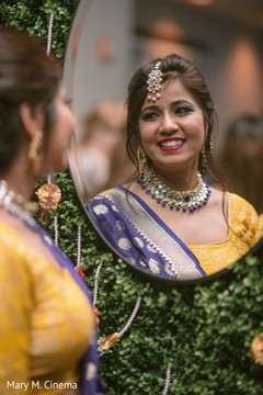 Adorable indian bride looking herself in the mirror Adorable indian bride looking herself in the mirror