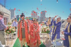Indian bride and groom walking out from the ceremony isle Indian bride and groom walking out from the ceremony isle