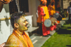 Indian groom having water pour on to his head capture. Indian groom having water pour on to his head capture.