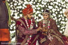 Enchanting Indian groom putting ring to bride. Enchanting Indian groom putting ring to bride.