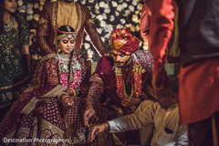 Indian couple making offering to sacred fire. Indian couple making offering to sacred fire.