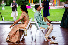 Indian couple playing the shoe game. Indian couple playing the shoe game.