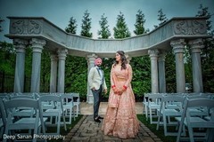 Indian bride and groom posing by the stage. Indian bride and groom posing by the stage.