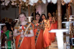 Enchanting Indian bridesmaids walking in the wedding aisle. Enchanting Indian bridesmaids walking in the wedding aisle.