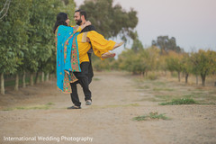 Romantic Indian groom carrying his maharani. Romantic Indian groom carrying his maharani.