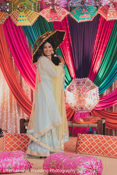 Gorgeous Indian bride posing for picture with a parasol. Gorgeous Indian bride posing for picture with a parasol.