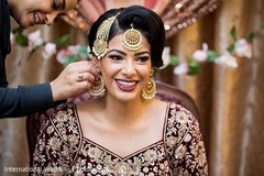 Maharani getting earrings on. Maharani getting earrings on.