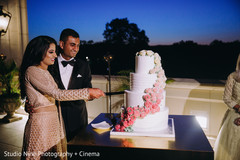 Lovely capture Indian bride and groom cutting cake together. Lovely capture Indian bride and groom cutting cake together.
