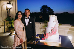 Indian wedding reception cutting the cake moment. Indian wedding reception cutting the cake moment.