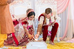 Indian couple lighting up the sacred fire ritual. Indian couple lighting up the sacred fire ritual.