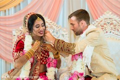 Tying of the Mangalsutra ritual. Tying of the Mangalsutra ritual.