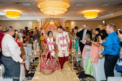 Enchanting indian couple walking out from wedding ceremony. Enchanting indian couple walking out from wedding ceremony.