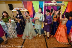 Happy Indian couple dancing with guests. Happy Indian couple dancing with guests.