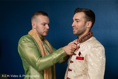 Indian groom getting his sherwani on. Indian groom getting his sherwani on.