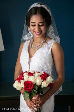 Lovely Indian bride holding her wedding bouquet. Lovely Indian bride holding her wedding bouquet.
