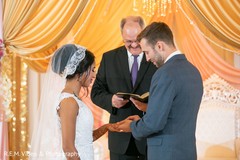 Indian groom putting the ring to bride. Indian groom putting the ring to bride.