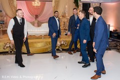 Charming Indian groomsmen dancing at reception. Charming Indian groomsmen dancing at reception.