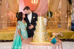 Indian wedding cake cutting fun moment. Indian wedding cake cutting fun moment.