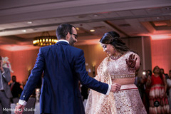 Adorable indian couple dancing during reception Adorable indian couple dancing during reception