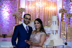 Indian couple posing with cake Indian couple posing with cake