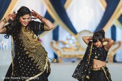 Indian bride dancing with cute little girl Indian bride dancing with cute little girl