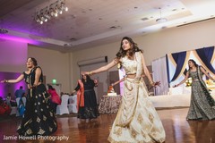 Indian bride dancing with bridesmaids on her wedding reception party Indian bride dancing with bridesmaids on her wedding reception party