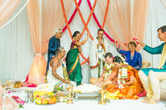 Indian couple receiving blessings during their wedding ceremony. Indian couple receiving blessings during their wedding ceremony.
