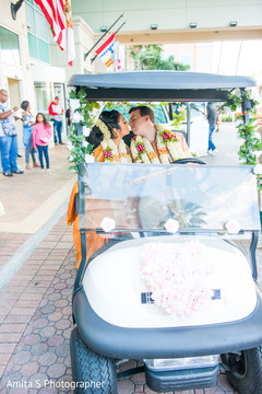 Indian couple in a golf kart. Indian couple in a golf kart.