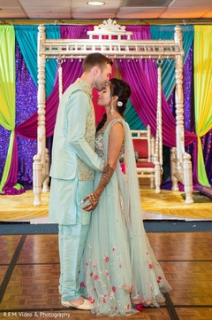 Sweet Indian groom kissing bride capture. Sweet Indian groom kissing bride capture.