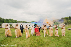 Indian bridesmaids with couple outdoors. Indian bridesmaids with couple outdoors.
