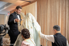 Elegant indian groom helping bride Elegant indian groom helping bride