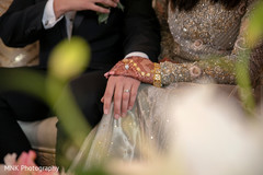 Indian bride and groom holding hands Indian bride and groom holding hands