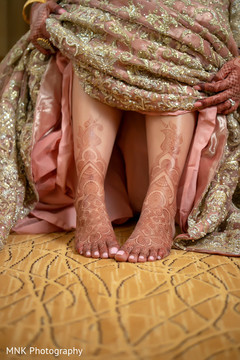 Beautiful indian bride showing henna art Beautiful indian bride showing henna art