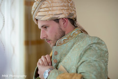 Adorable indian groom getting ready Adorable indian groom getting ready