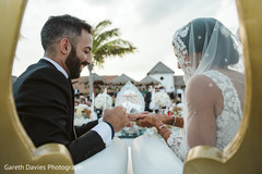 Indian couple exchanging rings capture. Indian couple exchanging rings capture.